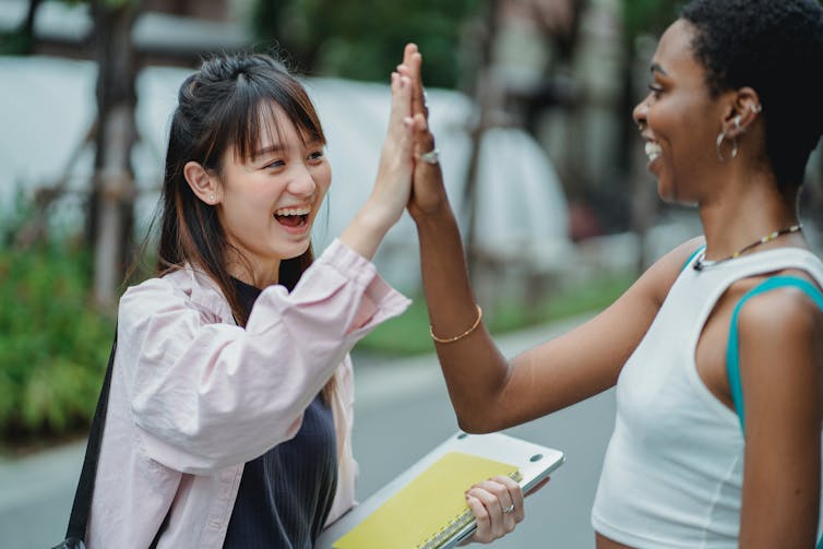 Students seen talking on a campus.