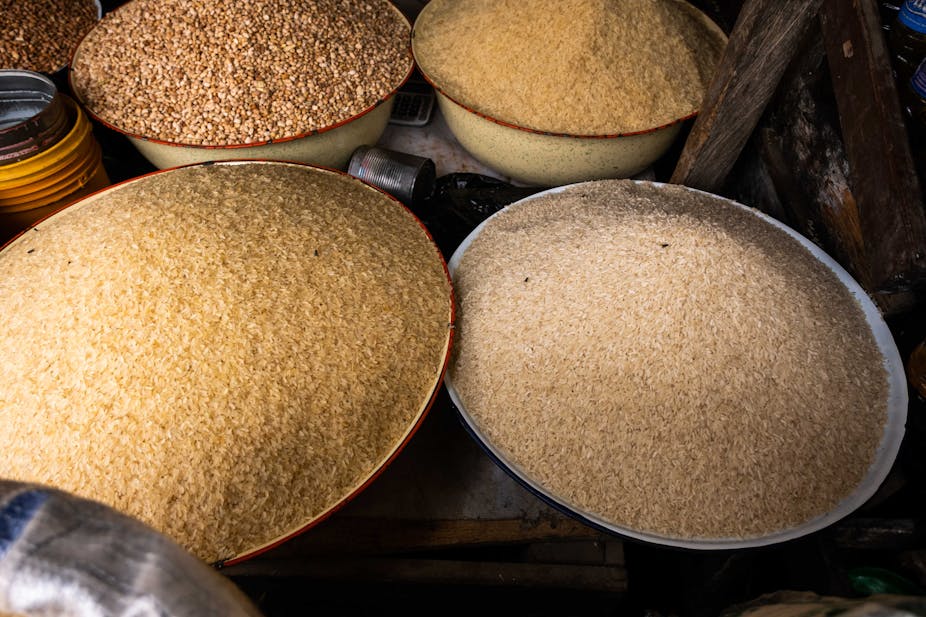 Bowls of rice grains at a market stall