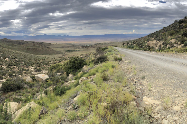 Road running through rocky terrain.