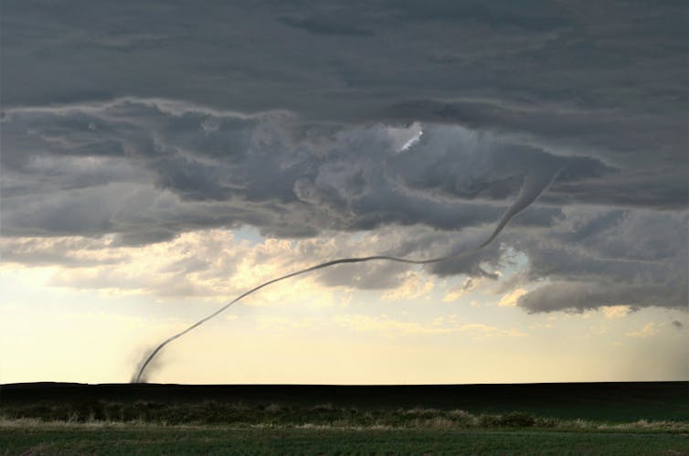 Long, thin tornado from thunderstorm base to ground