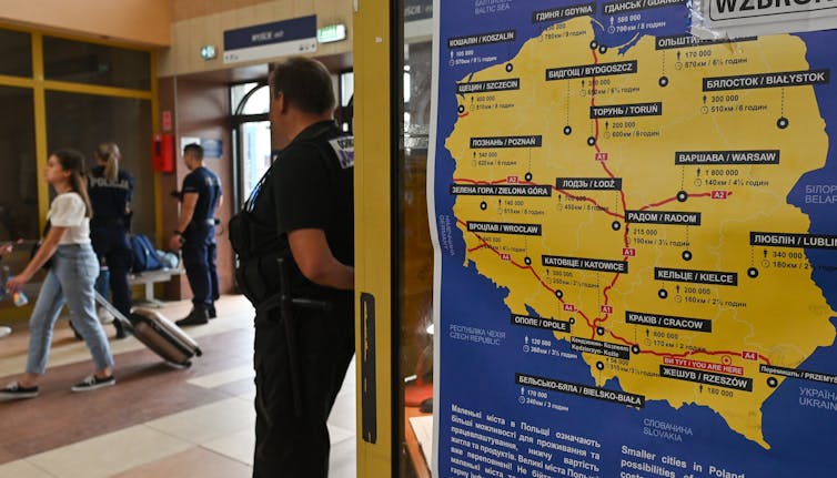 A map of Poland in yellow and blue in a transit station