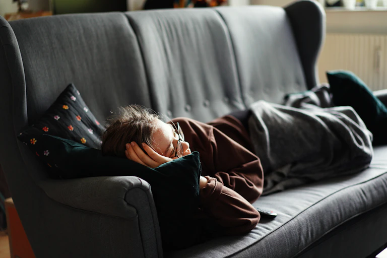 Teen laying on the couch