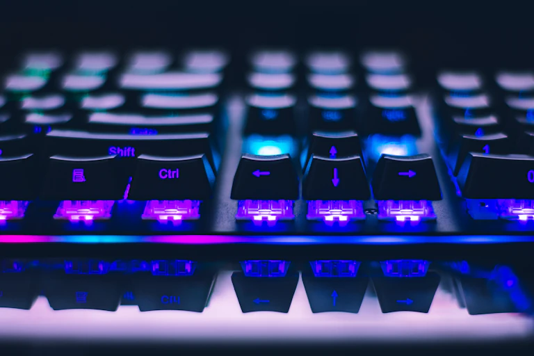 Close-up photo of an illuminated gaming keyboard.