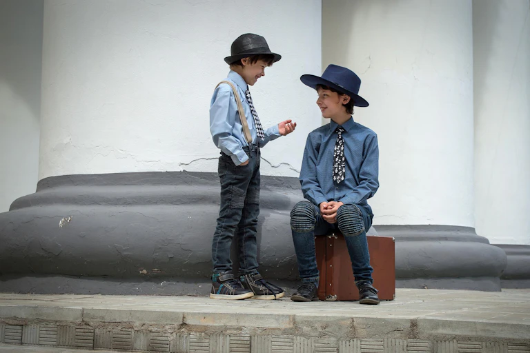 Two young children wearing costumes