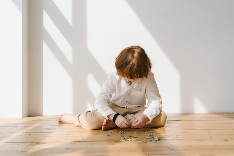 boy plays on floor