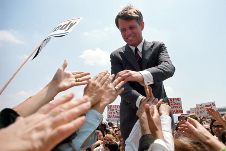 Politician shaking hands with supporters