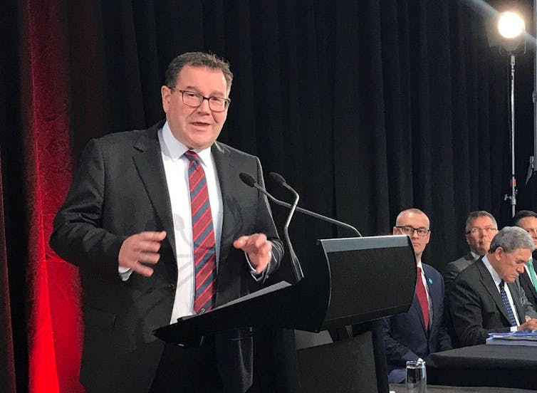 Politician making a speech in front of colleagues