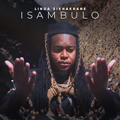 An album cover with a photo of a man in traditional attire, his eyes closed and his hands raised as if in praise or prayer.