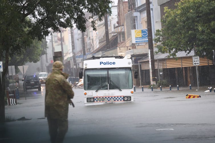 police van stuck in flood waters