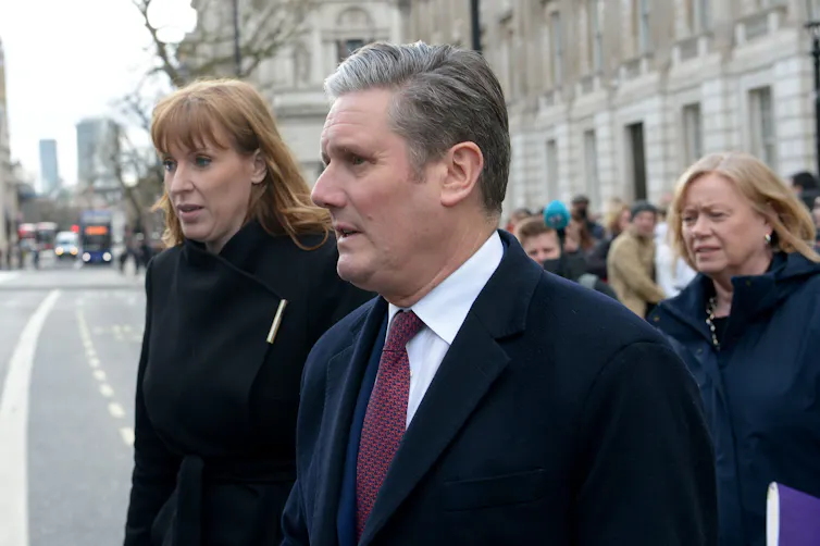 Angela Rayner and Keir Starmer walking in London.