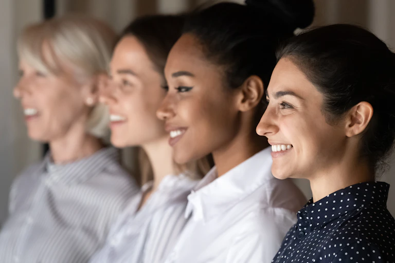 Female colleagues sitting in a row.