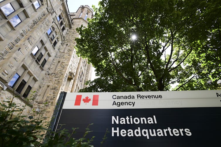 A sign for the Canada Revenue Agency's national headquarters pictures outside a buliding