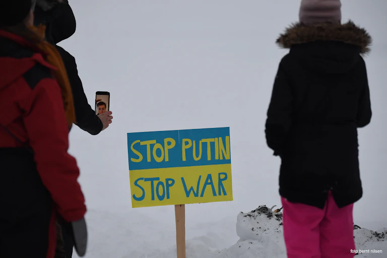 A sign reads 'Stop Putin, Stop War'