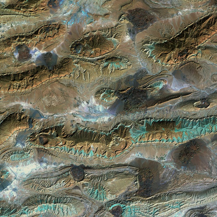 View from above of domes of rock between valleys