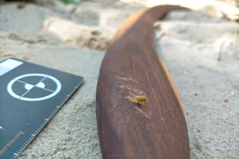A brown wood surface close-up with scratch marks
