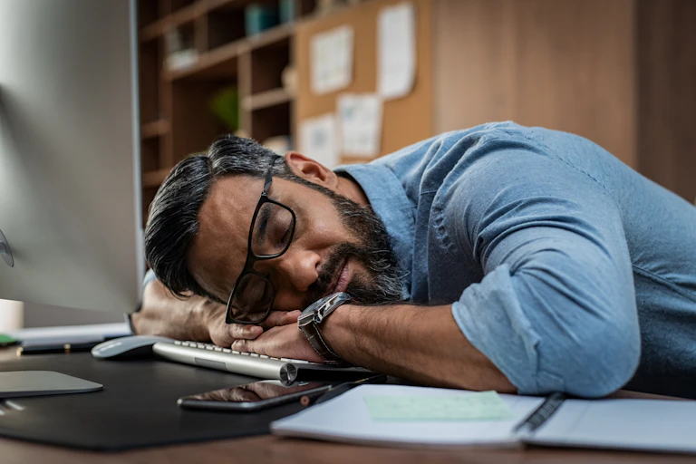 Man asleep on desk
