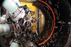 A complicated machine in a large tube.