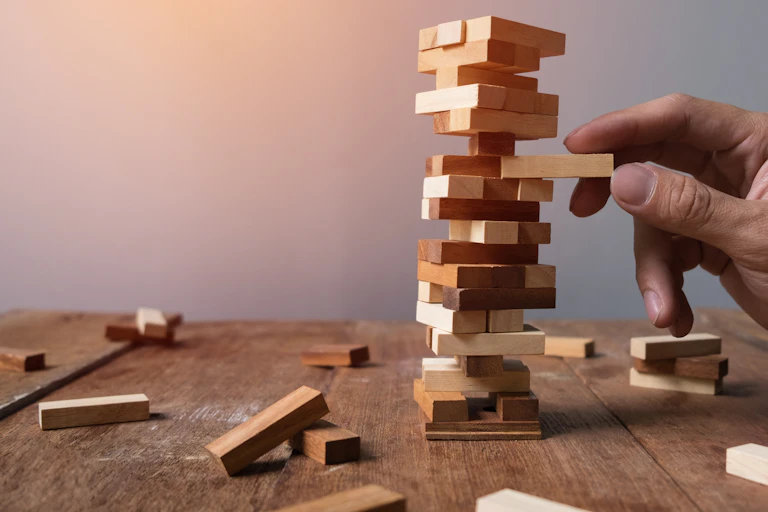 Jenga block tower ready to topple