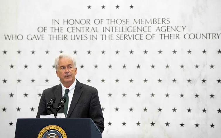 Man speaking at a lectern