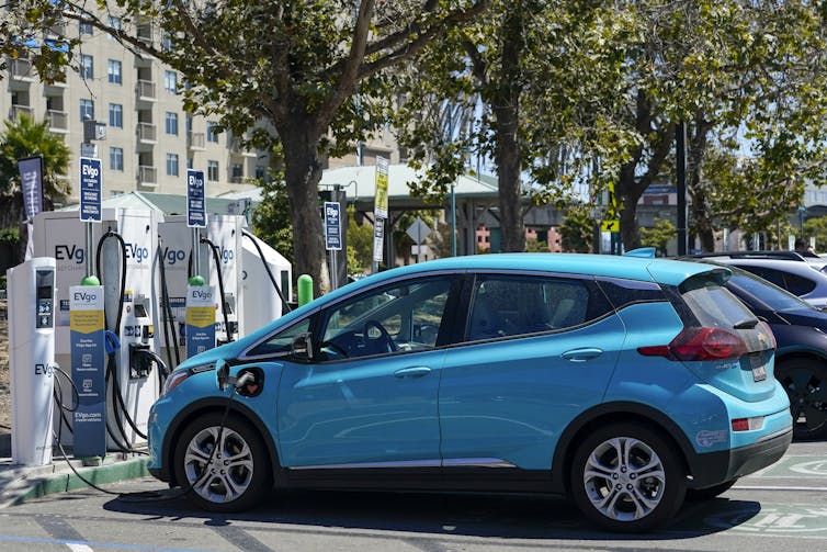 Electric car charging on the street