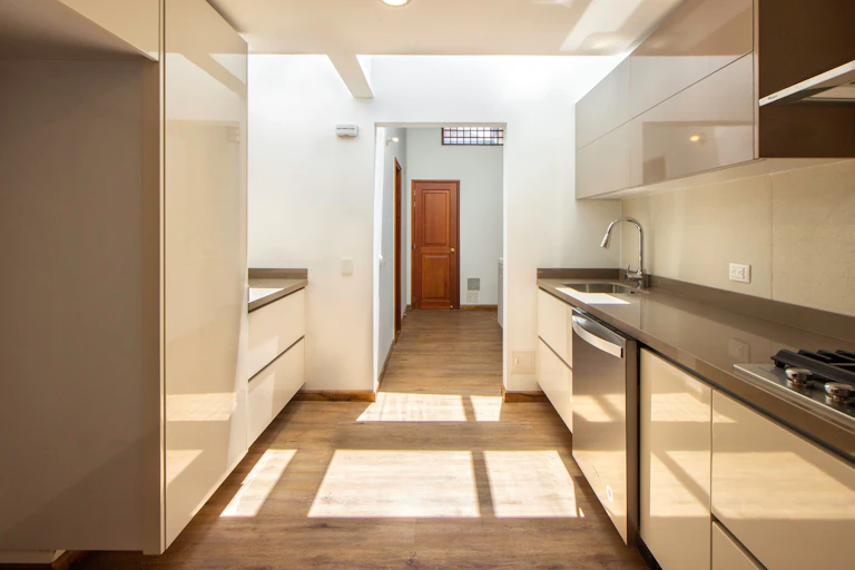 Looking through an empty house from the kitchen to the front door