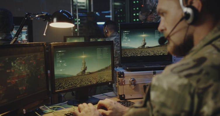 A soldier on a computer