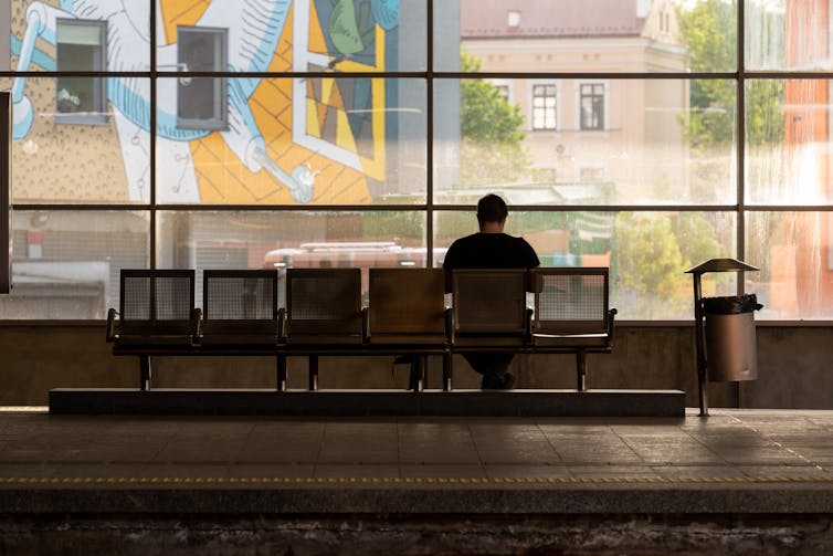 A man waiting for a train