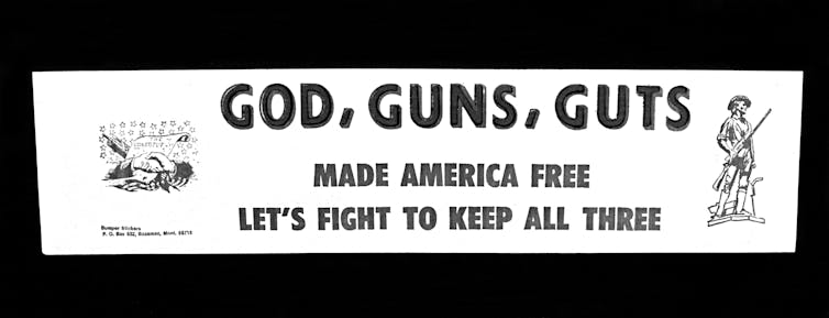 A sign saying God, Guns, Guts made America free. Let's fight to keep all three.