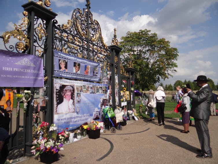 Banners and flowers honouring Diana on the gates of Kensington Palace