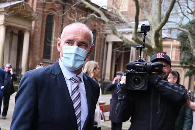 Chris Dawson wearing a mask arriving at court in Sydney