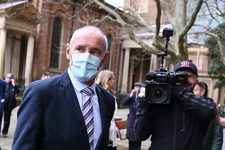 Chris Dawson wearing a mask arriving at court in Sydney