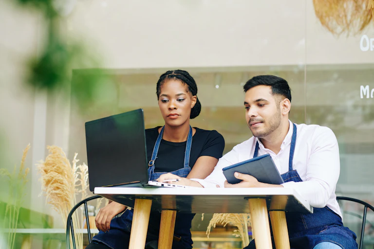 Business owners, table, laptop