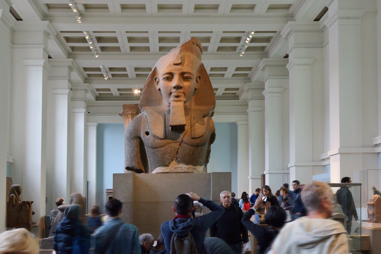 A large ancient Egyptian statue on display in a museum.
