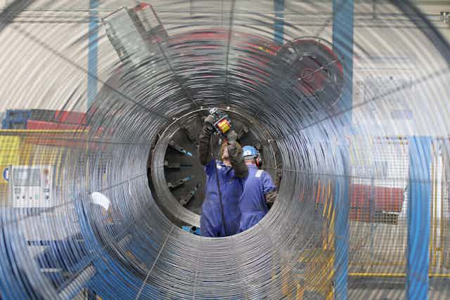 Workers working on a section of the NordStream pipeline.