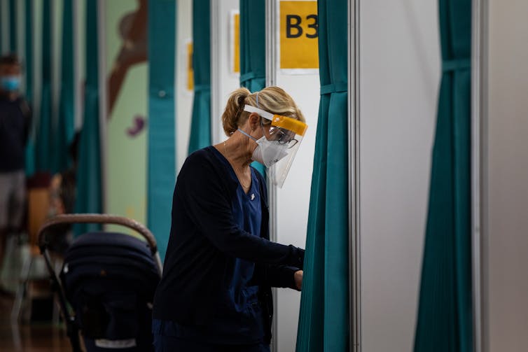 Nurse vaccinator prepares paperwork