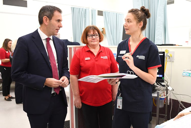Treasurer Jim Chalmers speaks to a nursing teacher and student at Griffith University.