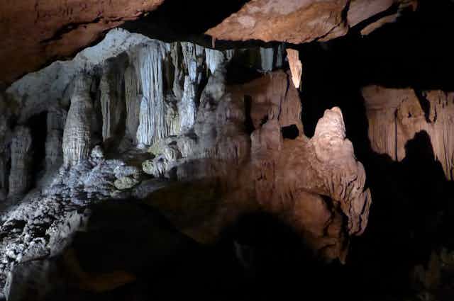 An image inside a cave showing stalagmites and stalactites looking a bit like a monster's teeth.
