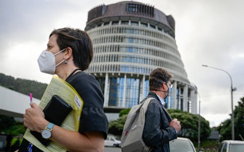 How should New Zealand manage COVID from now – limit all infections or focus on preventing severe disease?