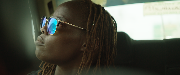 Woman in the back seat of a taxi