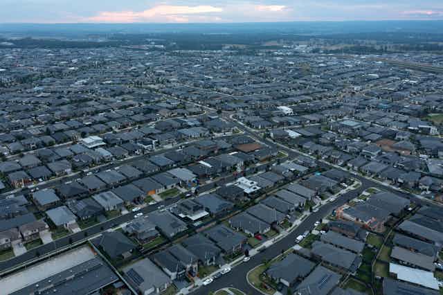 Aerial view of new suburban housing stretching to the horizon