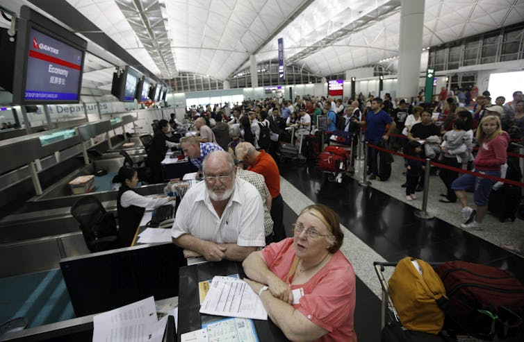 Qantas passengers stranded at Hong Kong International Airport on Saturday, October 29 2011 after management grounded the airline's global fleet and locked out workers during enterprise agreement negotiations.