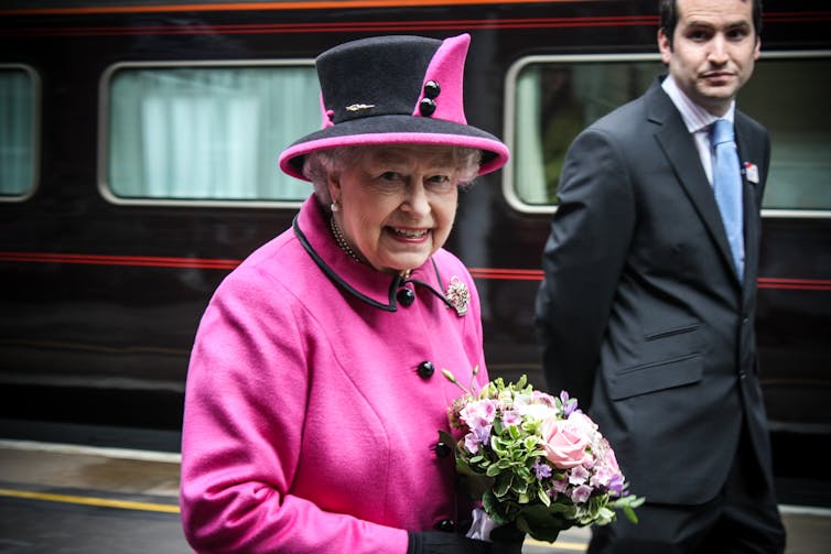 Queen Elizabeth holds a bouquet