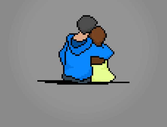 A pixelated image of a man and a woman hugging