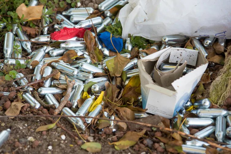 Discarded nitrous oxide canisters.