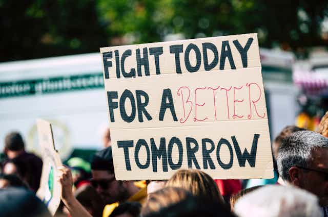 Protest sign: "Fight today for a better tomorrow"