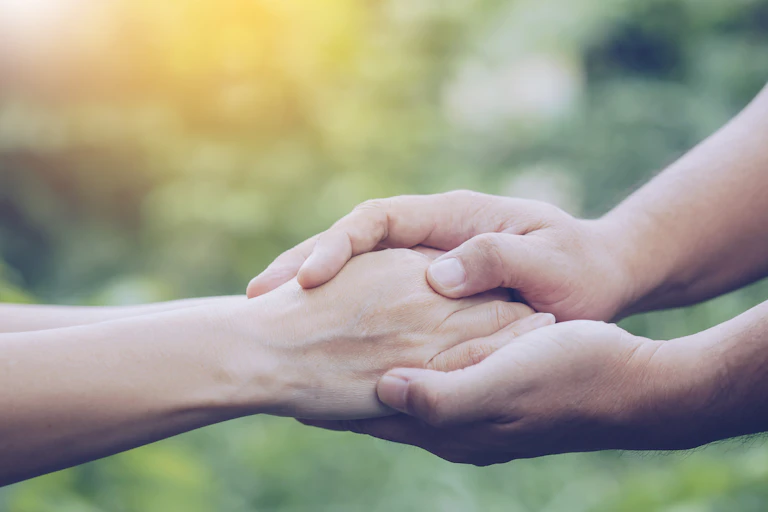 hands clasped together