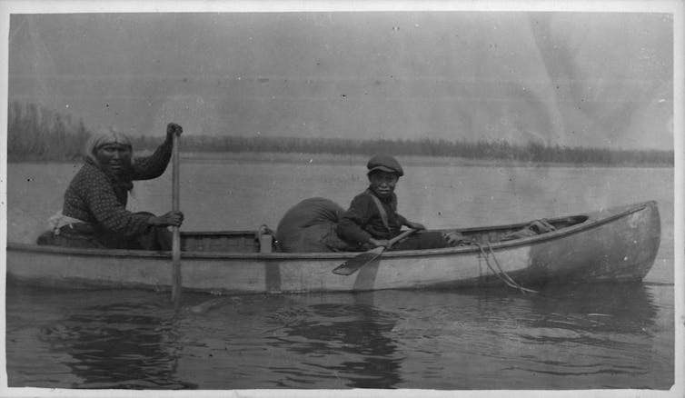 A mother and son in a canoe