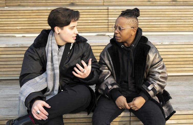 Two people sitting and having a serious conversation