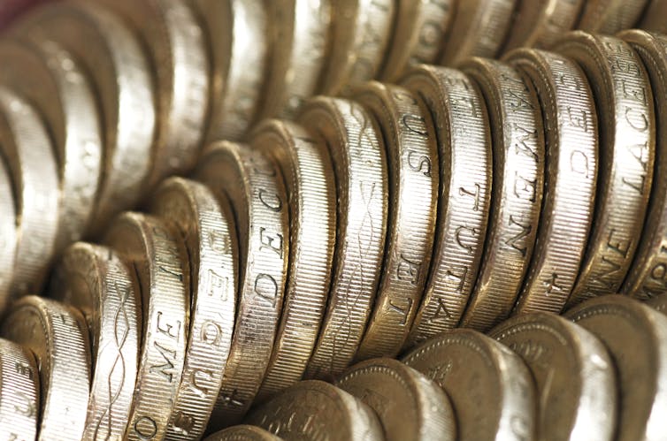 Rows of pound coins.