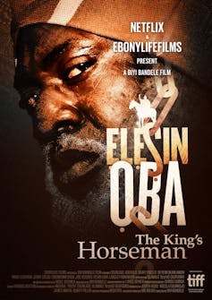 A movie poster featuring a man looking sideways and with suspicion. He has a greying beard and moustache.